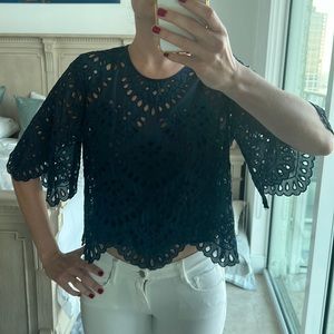 Love Sam size small navy blue bell sleeved blouse with slip and cutouts.